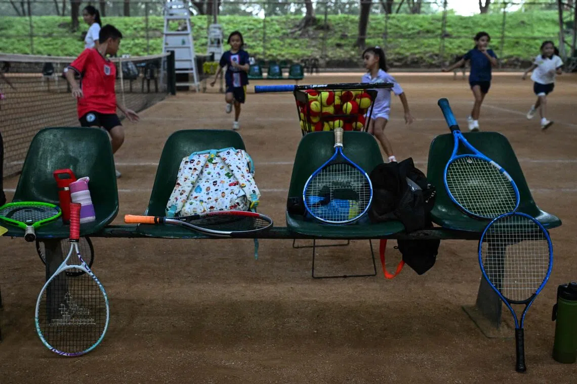 This photo taken on Aug 7 shows tennis rackets on a bench as children take part in a training session at Alabang Tennis Academy in Muntinlupa, Metro Manila.