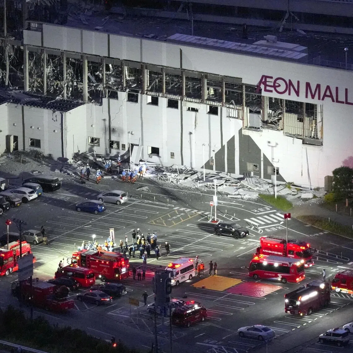 Emergency workers were set to work throughout the night to find people trapped inside Aeon Mall, in Kashima Town, in Japan’s Kumamoto prefecture, after a July 28 earthquake.