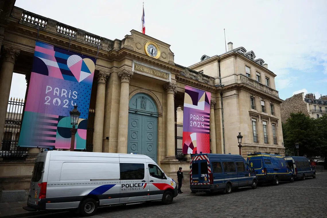 French police and gendarmerie trucks are parked near the National Assembly during the second round of the early French parliamentary election,  in Paris, France, July 7, 2024. REUTERS/Guglielmo Mangiapane