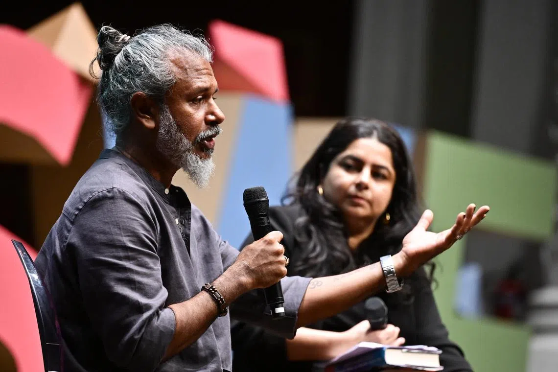 Sri Lankan Booker Prize-winning novelist Shehan Karunatilaka (left) with former Singapore Writers Festival (SWF) director Pooja Nansi at the Victoria Concert Hall on Nov 10. 