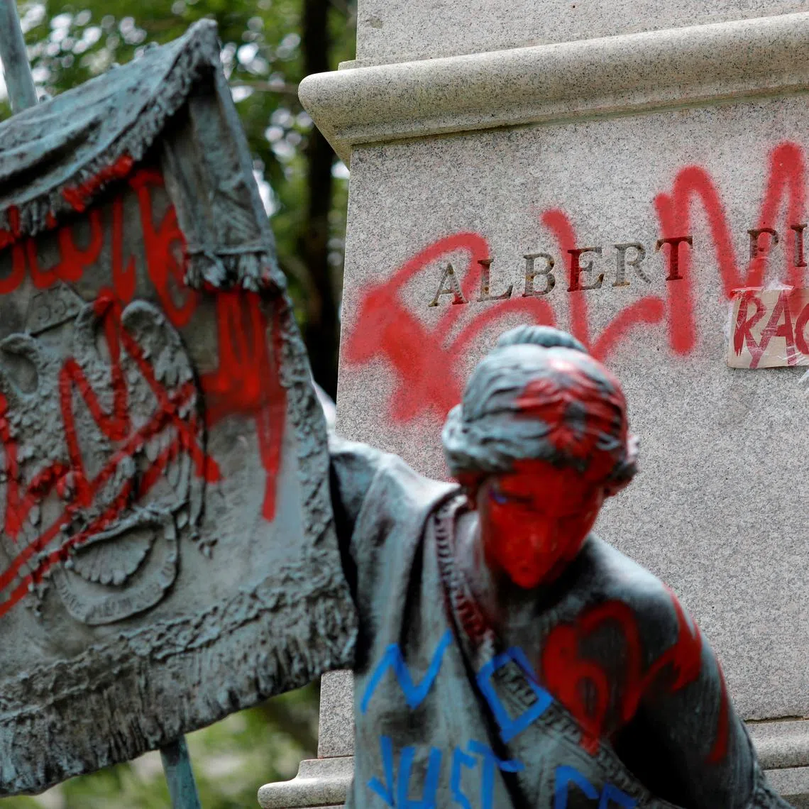 FILE PHOTO: Messages of protest remain after protesters toppled the statue of Albert Pike, amid a series of racial inequality protests, at the Brigadier General Albert Pike Statue site near Capitol Hill in Washington, U.S., July 7, 2020. REUTERS/Tom Brenner/File Photo