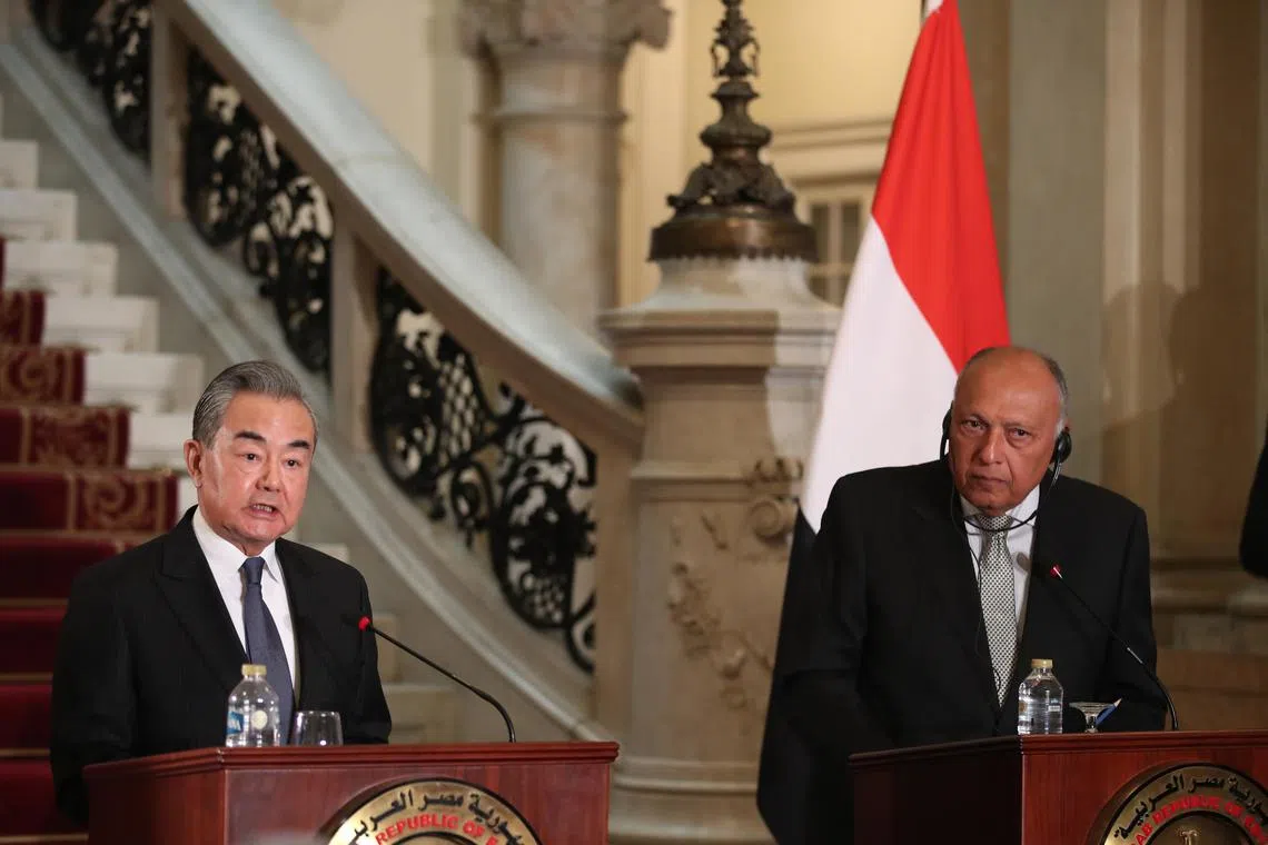 Egypt's Foreign Minister Sameh Shoukry (right) and Chinese Foreign Minister Wang Yi attend a joint press conference after their meeting at Tahrir palace in Cairo, Egypt.