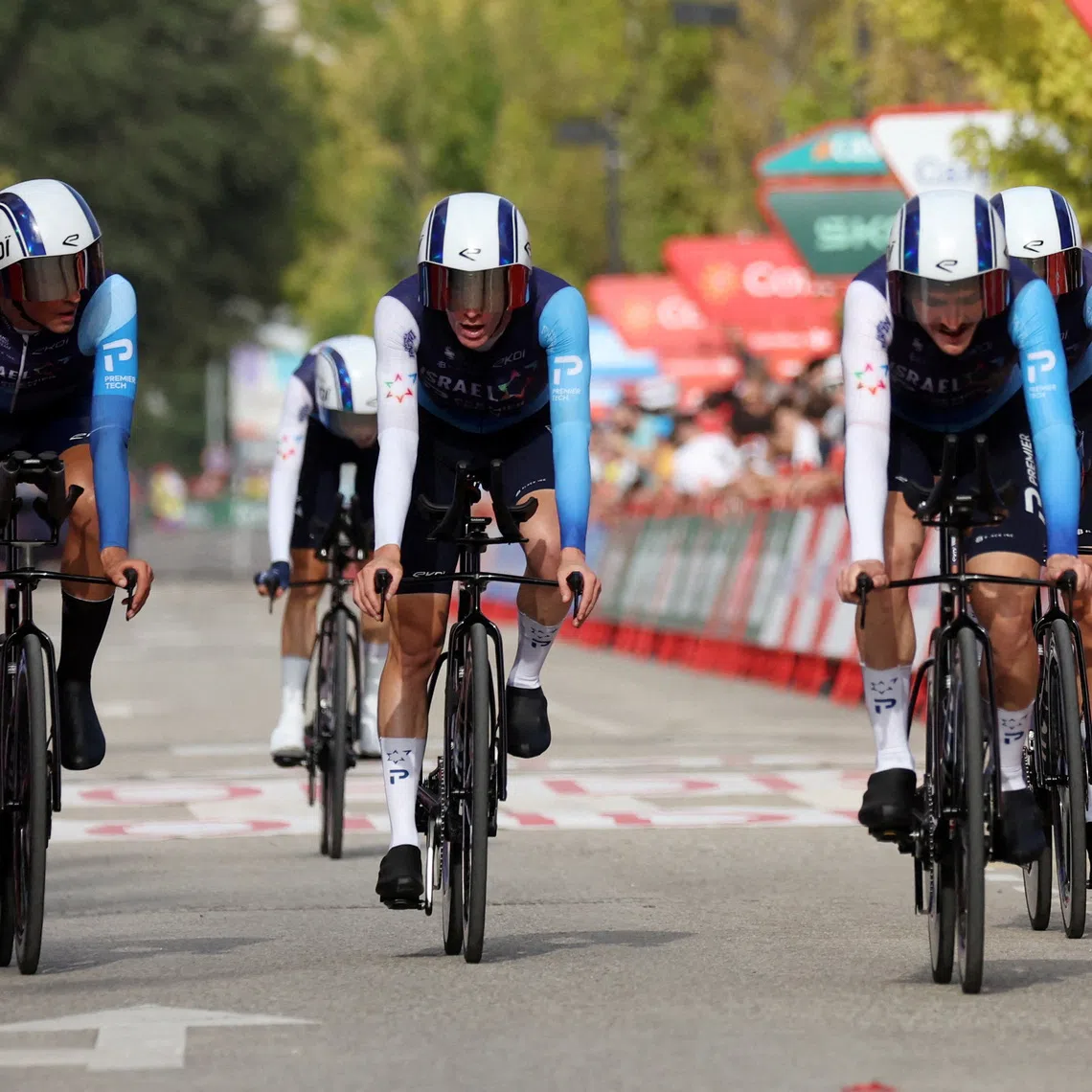 FILE PHOTO: Cycling - Vuelta a Espana - Stage 5 - Figueres to Figueres - Figueres, Spain - August 27, 2025 Team Israel - Premier Tech cross the finish line after stage 5 REUTERS/Bruna Casas/File Photo