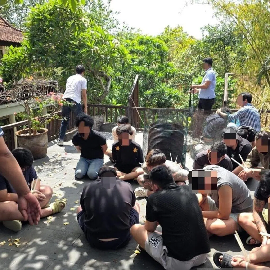Malaysian and Singaporean nationals detained by Indonesian immigration officers amid a probe over online loan syndicate.