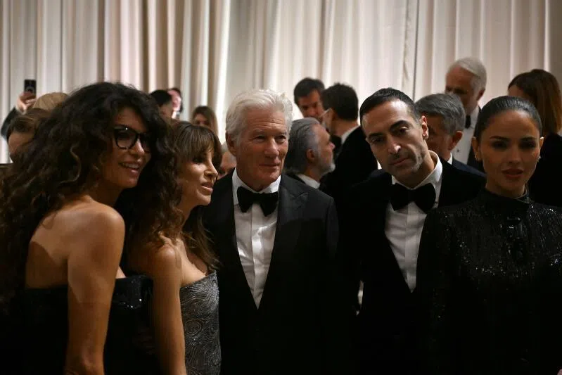 (From left) Italian-Tunisian former model and TV presenter Afef Jnifen, Richard Gere’s wife Alejandra Silva, US actor Richard Gere, Saudi film producer Mohammed Al Turki and Mexican actress Eiza Gonzalez pose after the Giorgio Armani collection show on Sept 28.