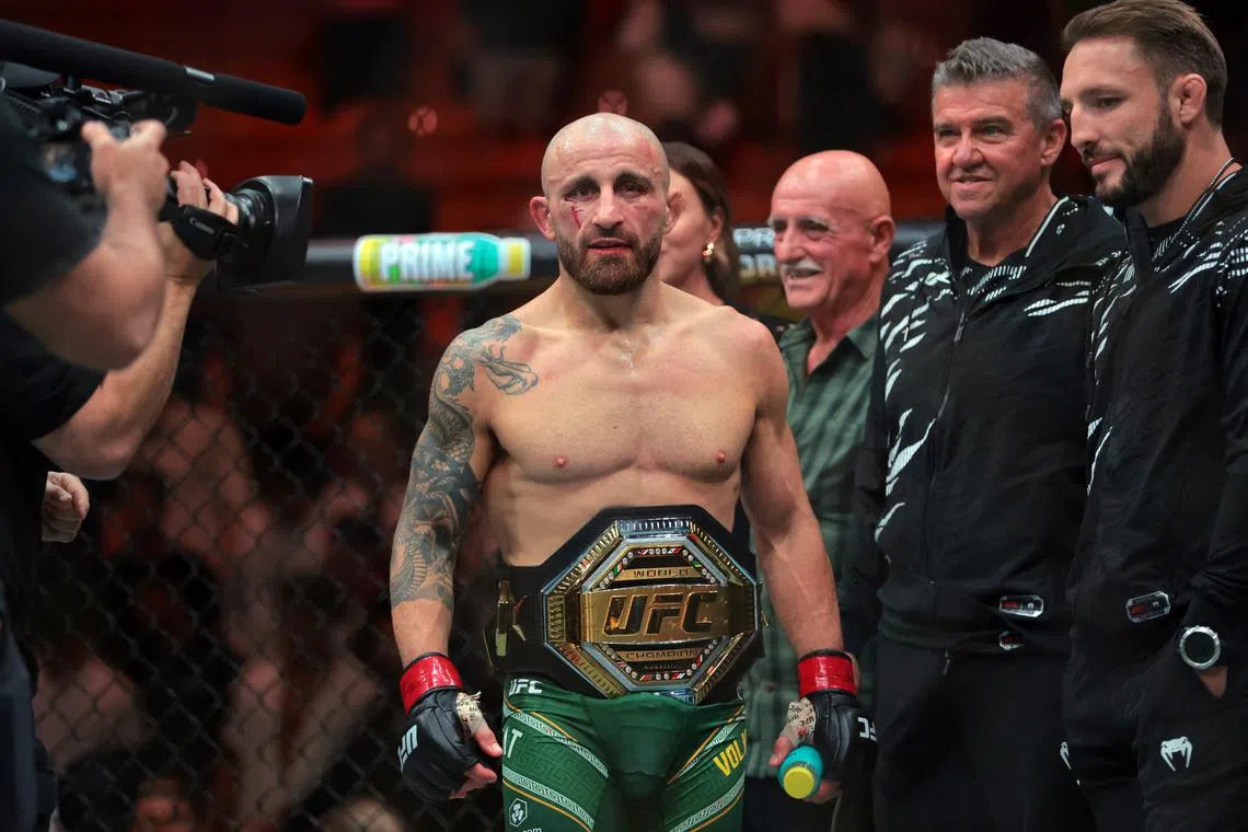 Apr 12, 2025; Miami, Florida, UNITED STATES; Alexander Volkanovski (red gloves) reacts after defeating Diego Lopes (not pictured) during UFC 314 at Kaseya Center. Mandatory Credit: Sam Navarro-Imagn Images