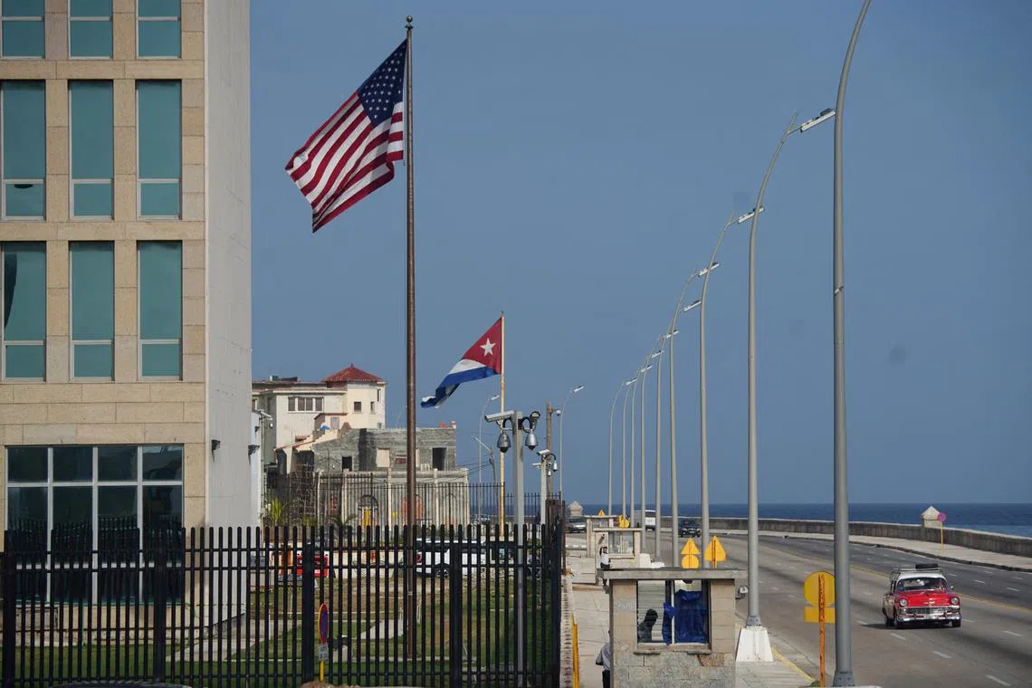 FILE PHOTO: A vintage car passes by the U.S. Embassy in Havana, Cuba, June 15, 2022. Picture taken on June 15, 2022. REUTERS/Alexandre Meneghini/File Photo