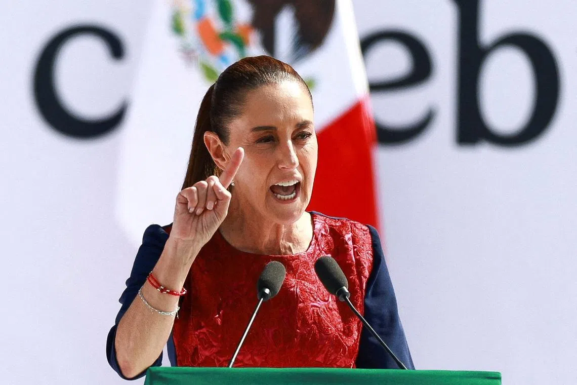 FILE PHOTO: Mexico's President Claudia Sheinbaum speaks during an event in Zocalo Square to commemorate 7 years since her party, Morena, came to power, in Mexico City, Mexico December 6, 2025. REUTERS/Raquel Cunha/File Photo