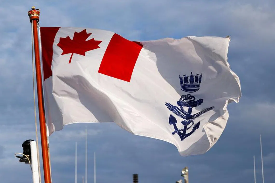 Canadian naval ensign is hoisted on the deck of the Royal Canadian Navy's Halifax-class frigate HMCS Calgary (FFH335) at the U.S. naval base in Yokosuka, Japan November 7, 2018. Picture taken November 7, 2018.  REUTERS/Issei Kato/File Photo