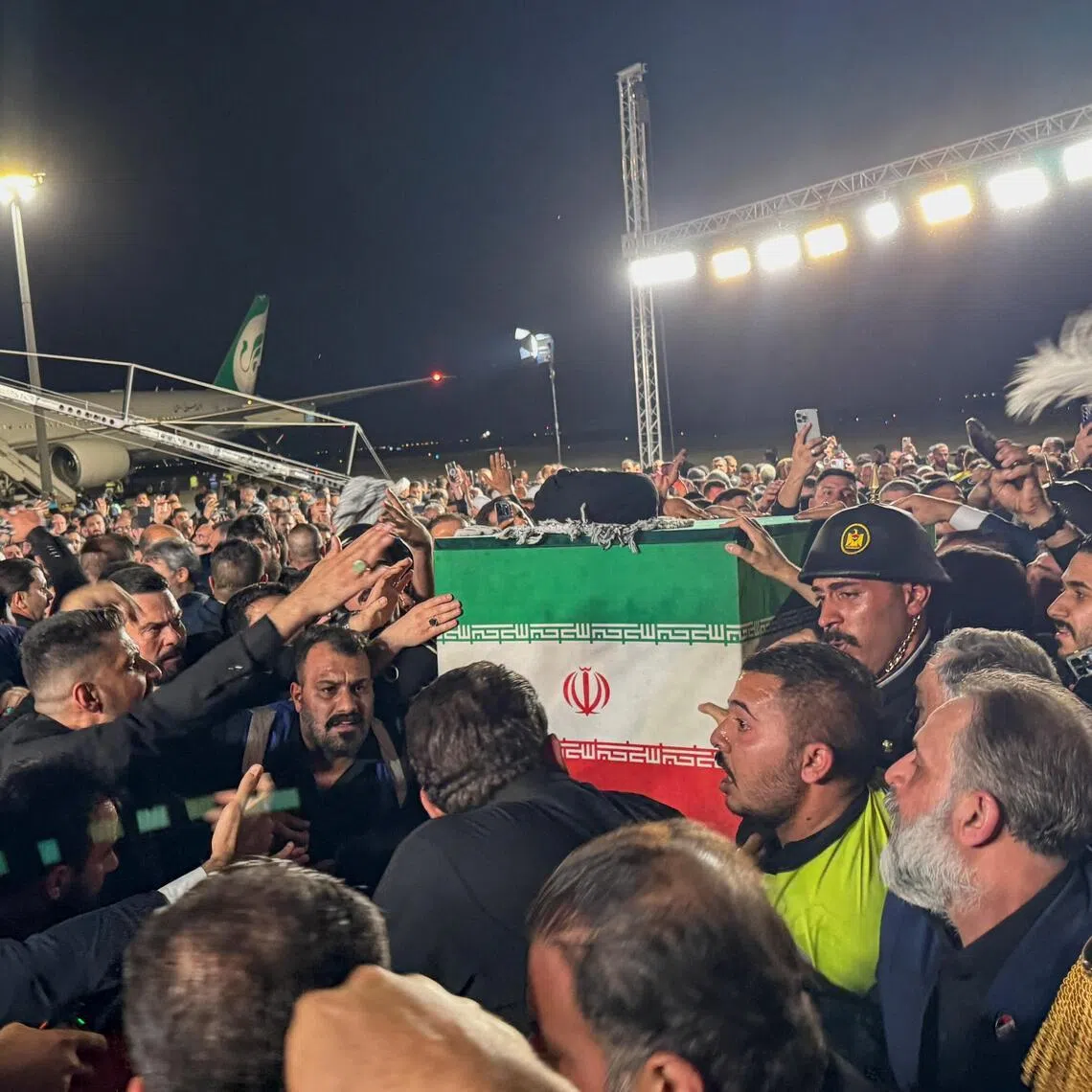 The coffin of Iran’s late Supreme Leader Ayatollah Ali Khamenei, who was killed on February 28 during Israeli and U.S. airstrikes on Iran, is carried after arriving aboard a Mahan Air aircraft at Najaf International Airport in Najaf, Iraq, July 7, 2026. Picture taken with a mobile phone. REUTERS/Stringer