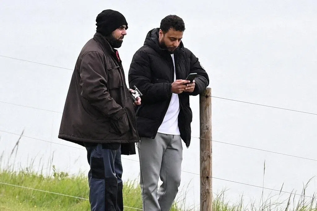 A police surveillance image shows Amar Hussein (left) and Walid Saadaoui.