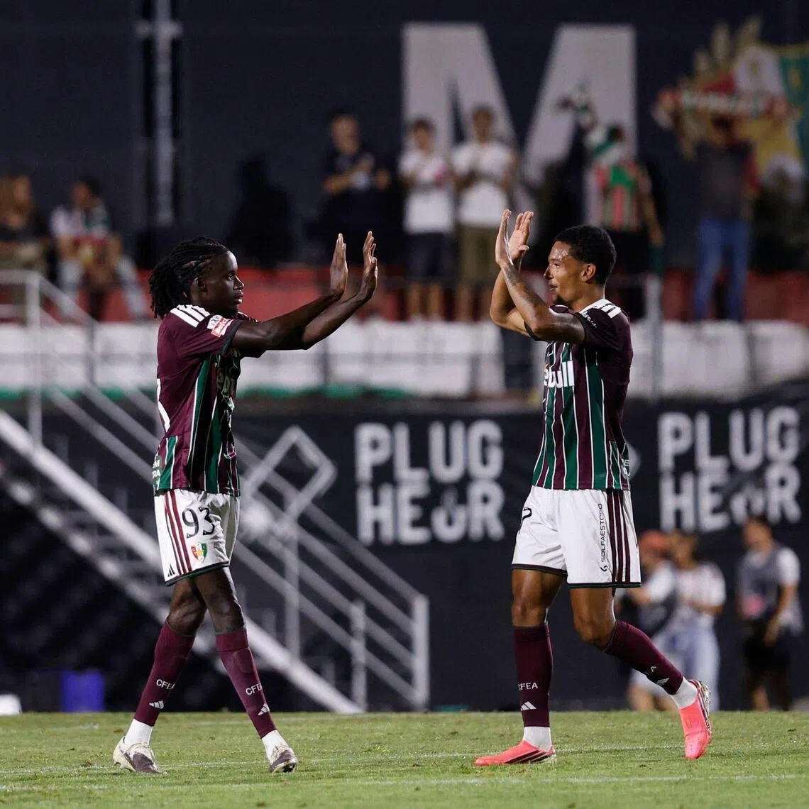 Estrela da Amadora’s French forward Benito Souza (left) celebrates scoring his team’s second goal with teammate Leandro Antonetti during the 2-2 Portuguese Primeira Liga draw with Sporting Lisbon at the Estadio Jose Gomes in Amadora on Aug 8.