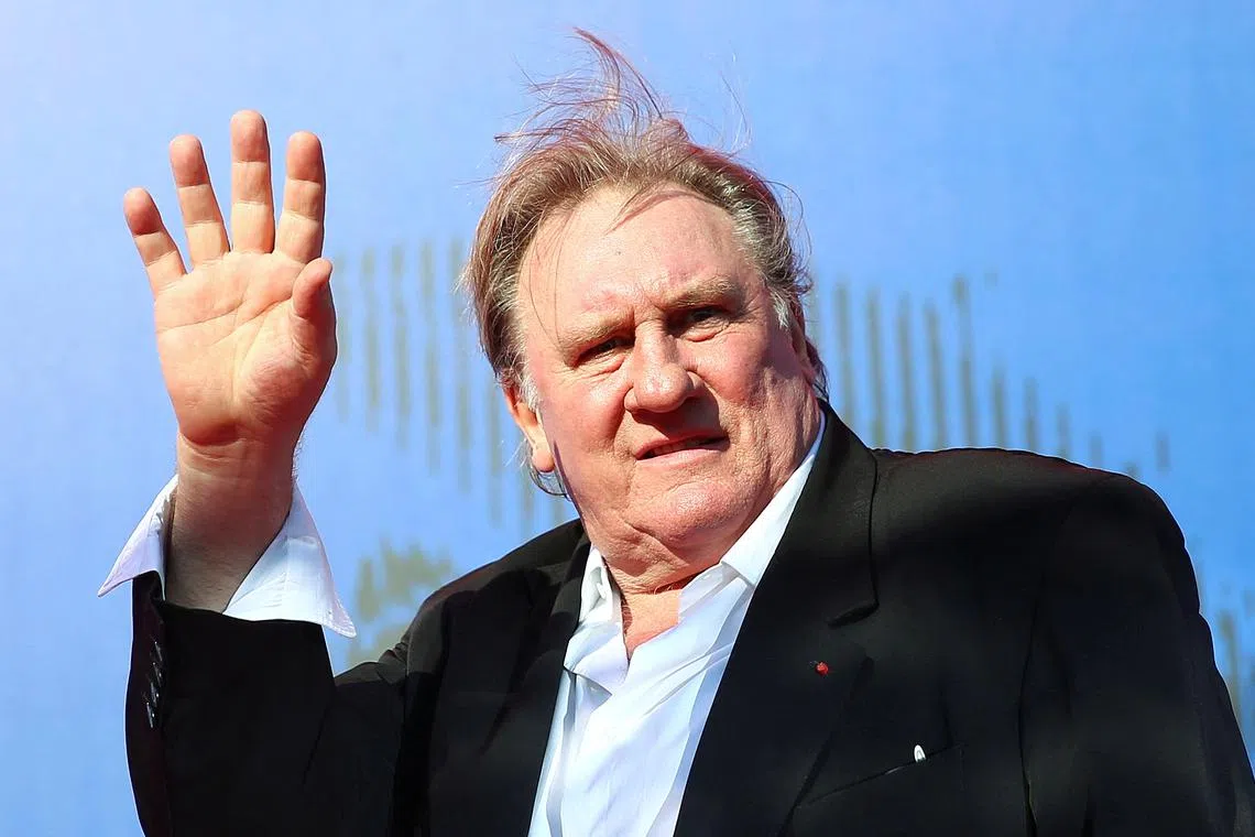 FILE PHOTO: Gerard Depardieu waves as he arrives during a red carpet event for the movie \"Novecento- Atto Primo\" at the 74th Venice Film Festival in Venice, Italy, Italy September 5, 2017. REUTERS/Alessandro Bianchi/File Photo