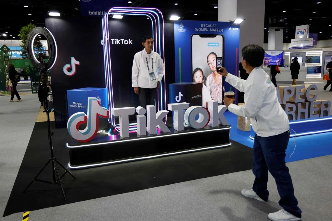 A man poses at a TikTok booth at the Asia-Pacific Economic Cooperation summit in Bangkok on Nov 18, 2022.