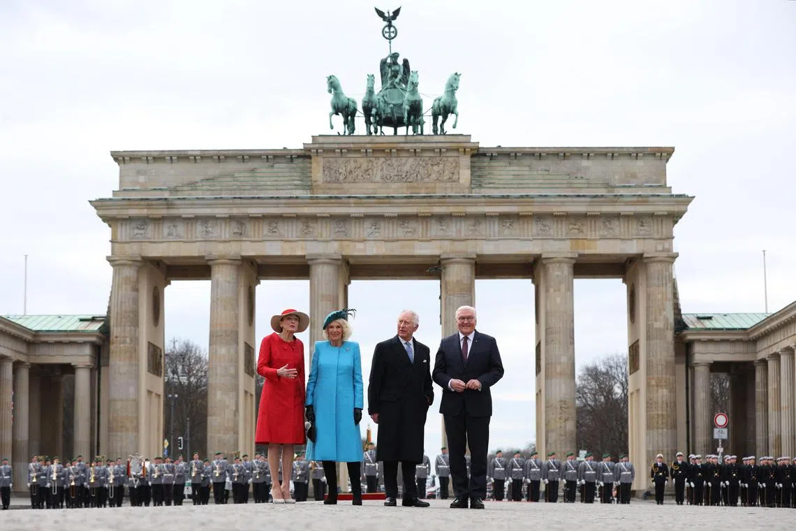King Charles (second from right) became the first visiting head of state to be given a ceremonial welcome at Berlin’s most famous landmark, the Brandenburg Gate.