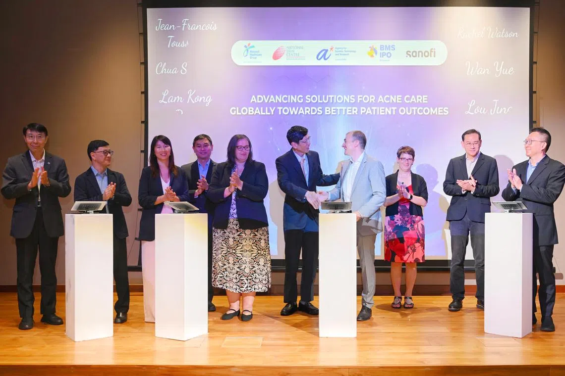 The Memorandum of understanding signing ceremony on advancing acne treatment research being signed at the National Skin Centre on Nov 22, 2024.