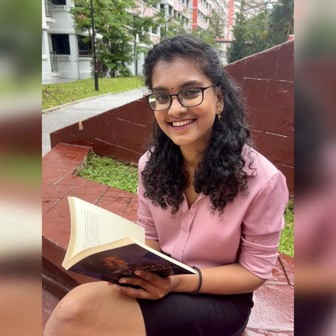 Ms Vishnu Vardni Anandan, member of the Tamil Language Council, with her favourite book, The Best I Could by Subhas Anandan. 