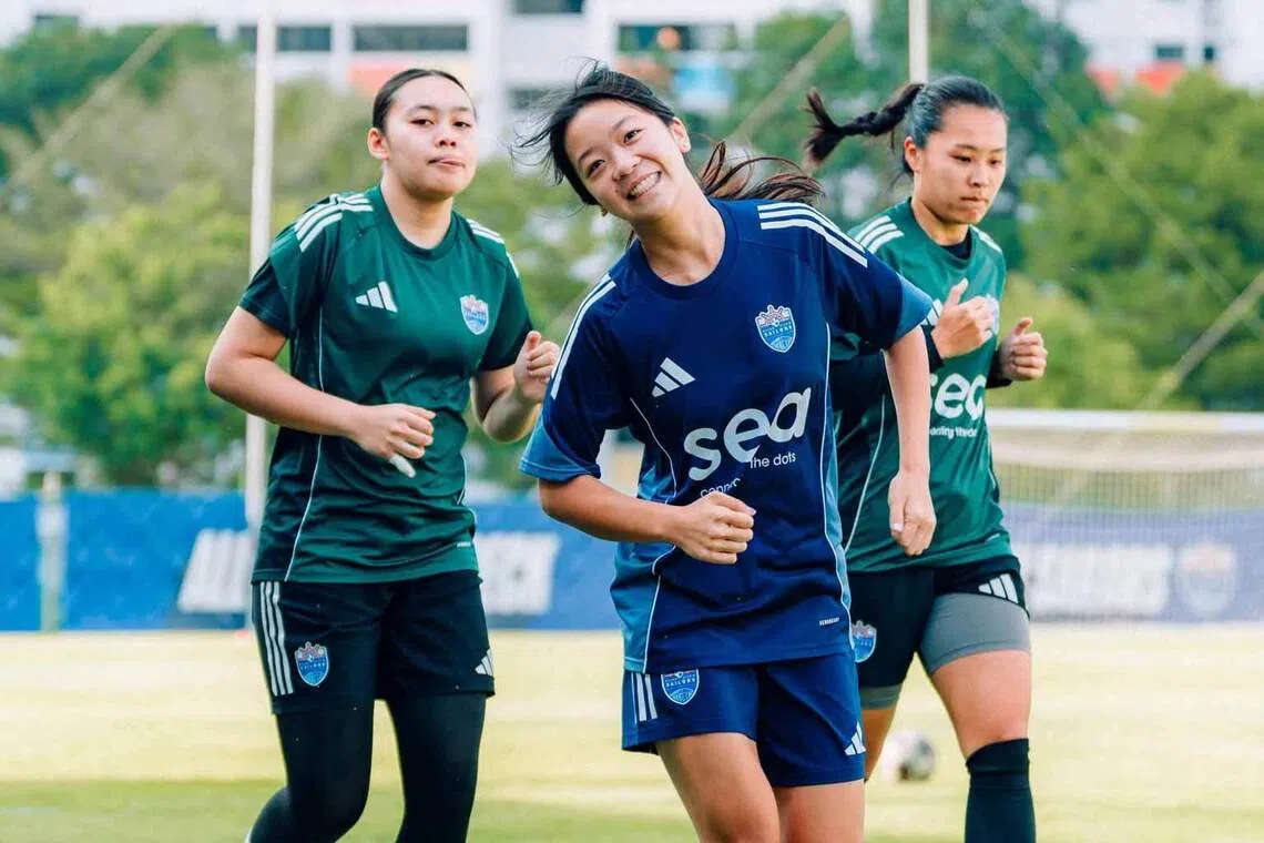 three lion city sailors women’s football players jog during training in singapore