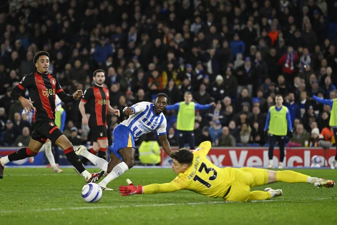 Soccer Football - Premier League - Brighton & Hove Albion v AFC Bournemouth - The American Express Community Stadium, Brighton, Britain - February 25, 2025 Brighton & Hove Albion's Danny Welbeck scores their second goal past AFC Bournemouth's Kepa Arrizabalaga REUTERS/Tony O Brien
