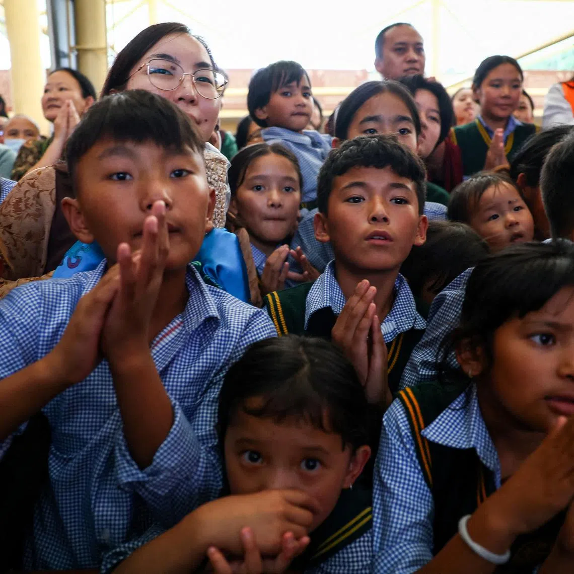 FILE PHOTO: Children attend the 90th birthday of Tibetan spiritual leader, the 14th Dalai Lama, at the Tsuglagkhang, also known as the Dalai Lama Temple complex, in the northern town of Dharamshala, India, July 6, 2025. REUTERS/Anushree Fadnavis/File Photo