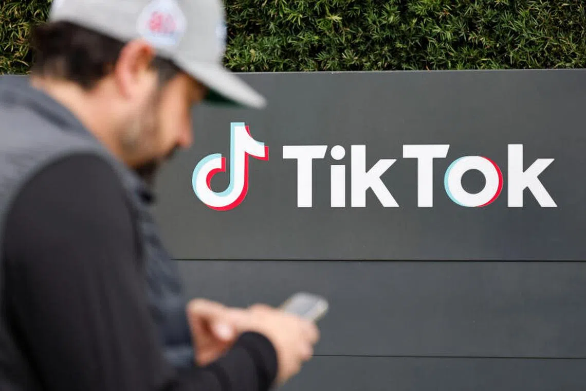 TikToker and "newsfluencer" Joe Andaloro, who goes by the TikTok handle @joy.of.everything, films a TikTok video outside the U.S. headquarters of the social media company TikTok in Culver City, California, U.S. January 18, 2025. REUTERS/Fred Greaves