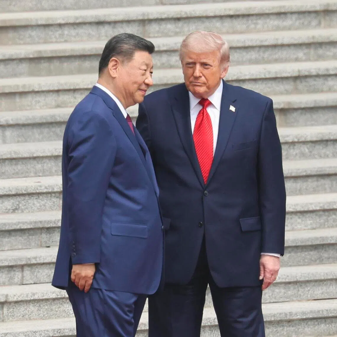 Chinese President Xi Jinping (left) greets US President Donald Trump during a welcome ceremony at the Great Hall of the People in Beijing, China, May 14. 