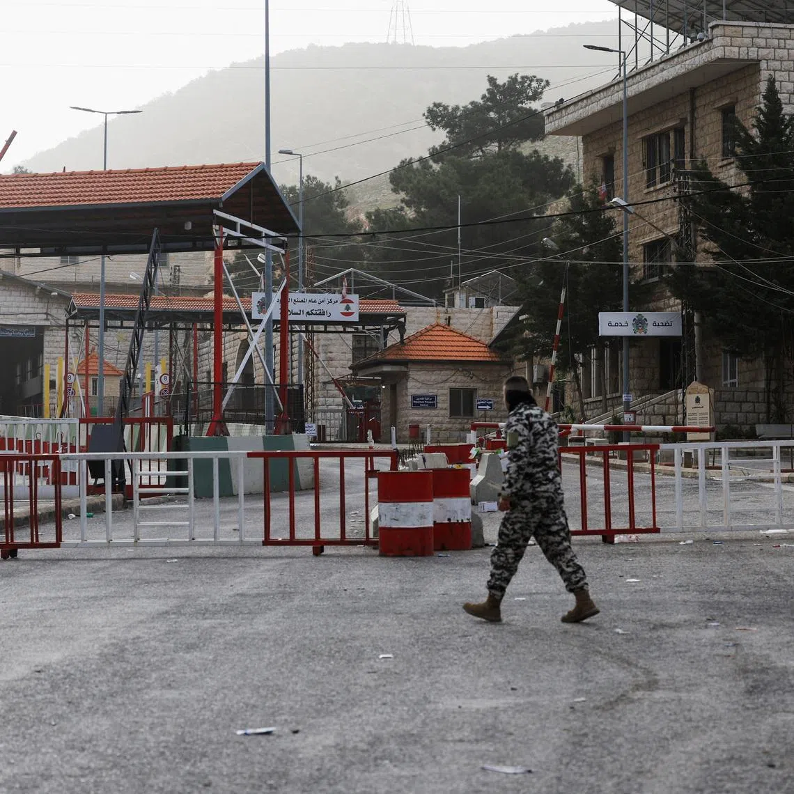 A man walks near the closed Lebanese-Syrian border checkpoint amid escalating hostilities between Israel and Hezbollah, as the U.S.-Israel conflict with Iran continues, near Masnaa, Lebanon, April 5, 2026. REUTERS/Mohamed Azakir