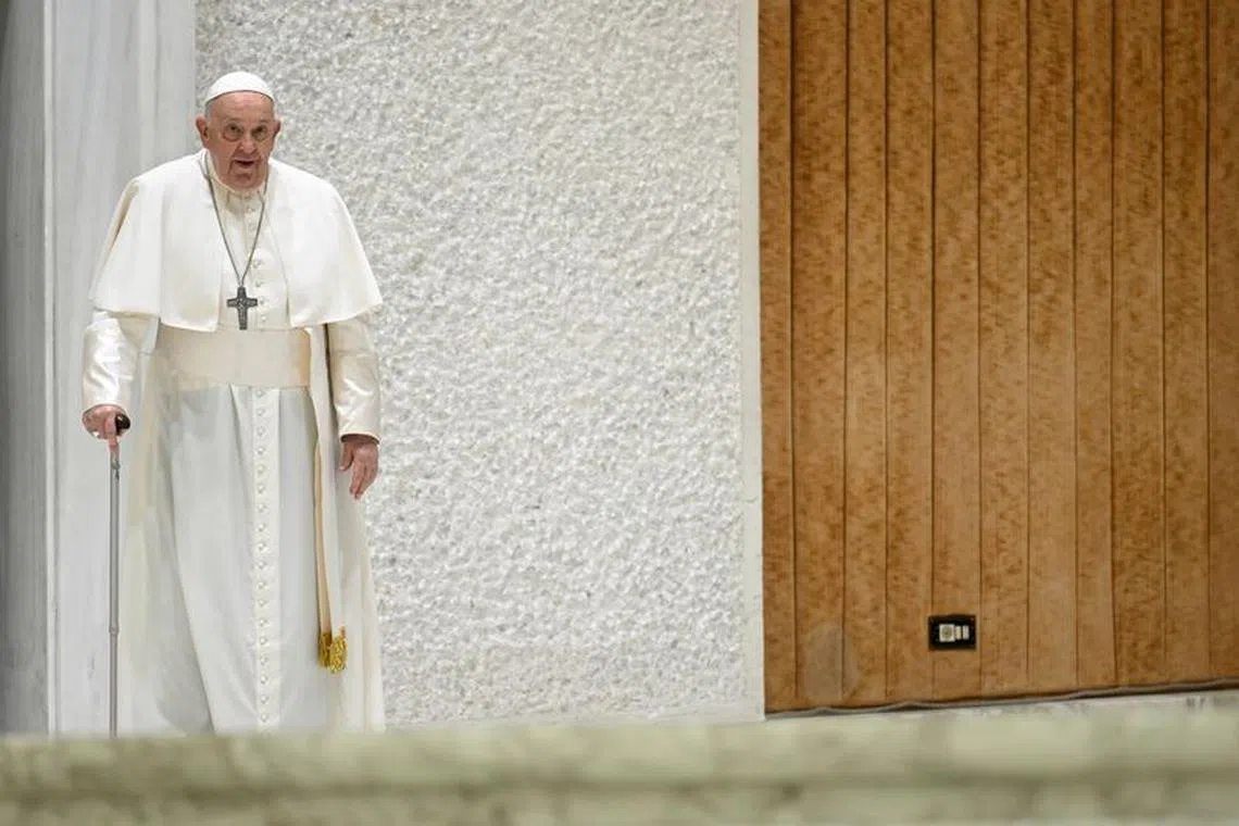 Pope Francis walks as he attends the weekly general audience, in Paul VI hall at the Vatican, November 29, 2023.   Vatican Media/­Handout via REUTERS