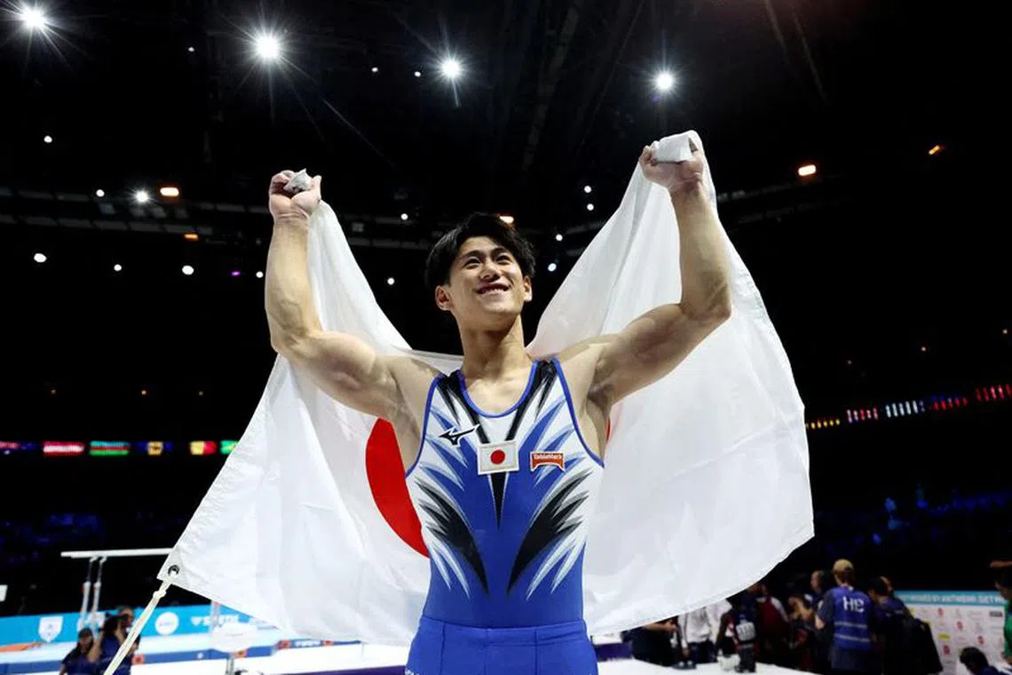 Gymnastics - 2023 World Artistic Gymnastics Championships - Sportpaleis, Antwerp, Belgium - October 5, 2023 Gold medallist Japan's Daiki Hashimoto celebrates winning the men's individual all-around final REUTERS/Yves Herman