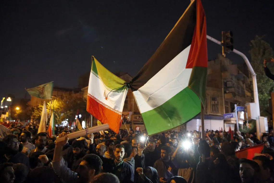 Pro-Palestine supporters gathered to show their solidarity with Gaza people in front of the British embassy in Tehran, Iran, on Oct 18.