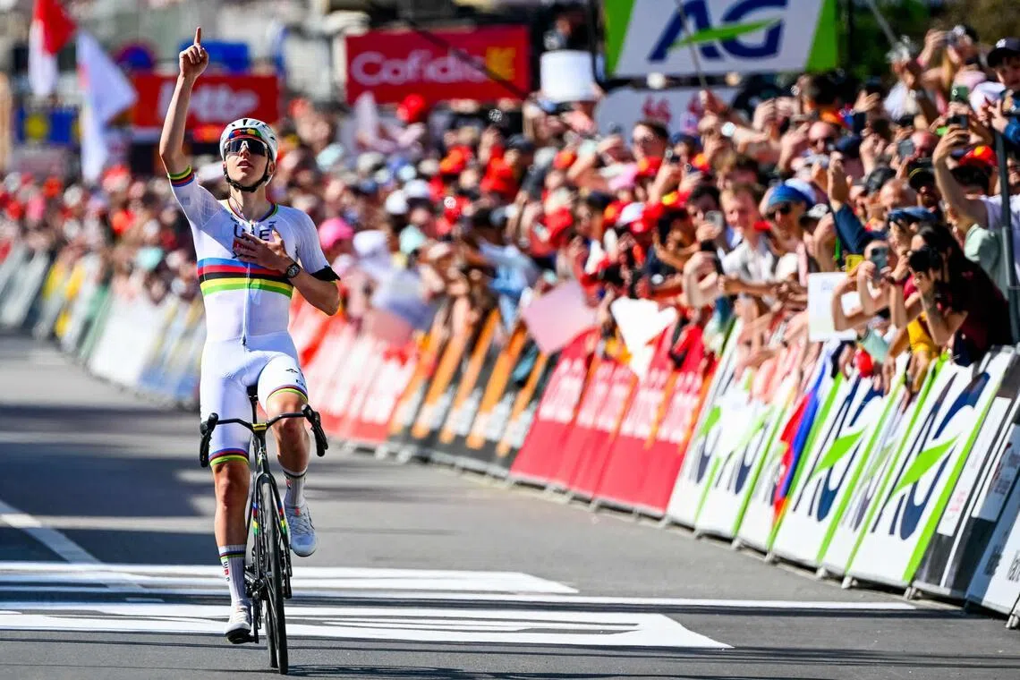 UAE Team Emirates-XRG's Slovenian rider Tadej Pogacar celebrates as he crosses the finish line in the men's elite race of the Liege-Bastogne-Liege UCI World Tour one-day cycling race, on April 26, 2026.
