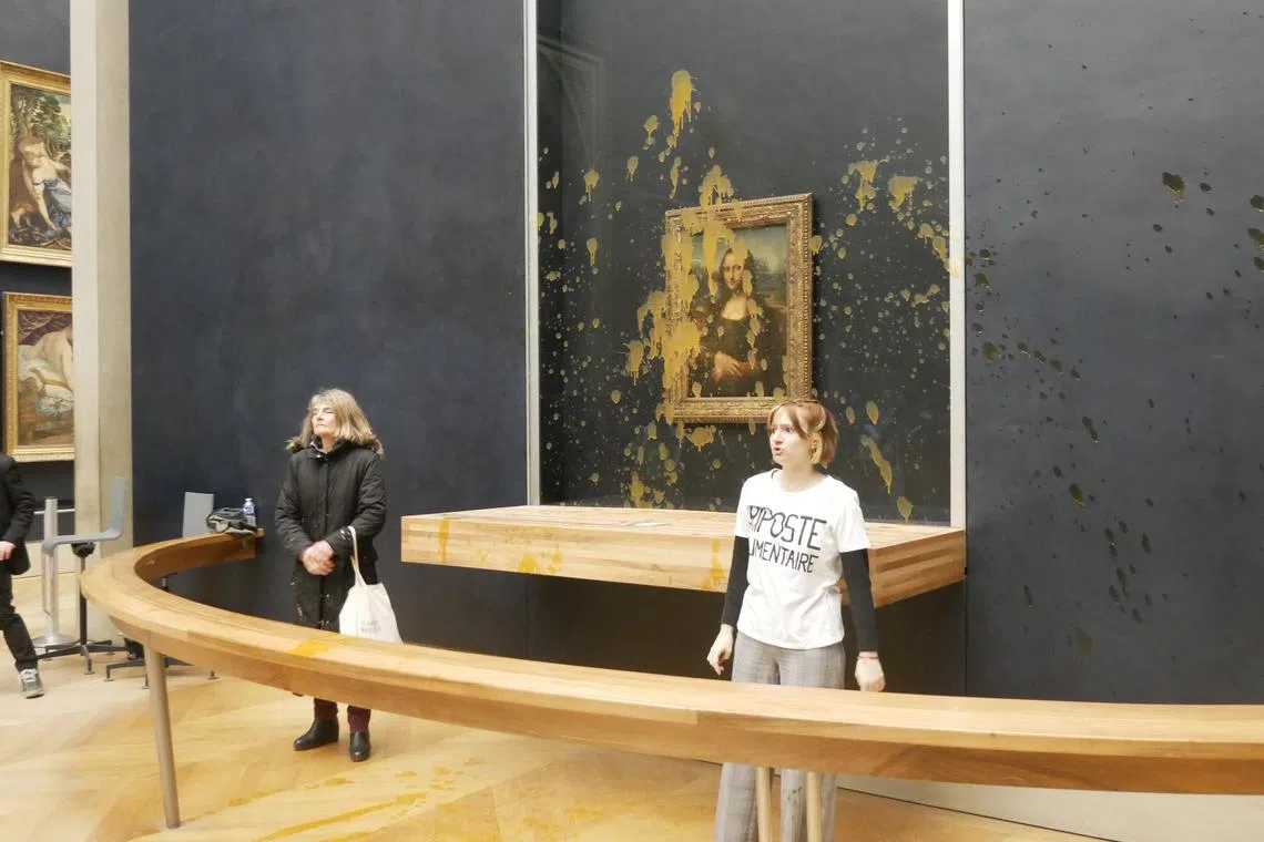 Two women decrying the agricultural system, after flinging soup onto the glass protecting the Mona Lisa at the Louvre museum.