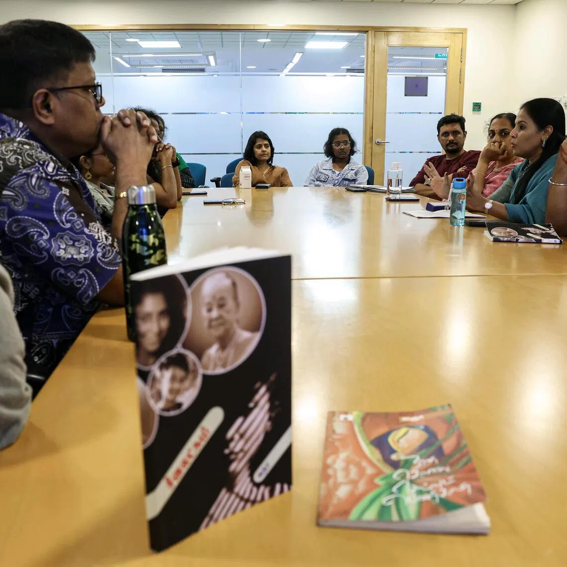 Members of the Maya Illakiya Vattam, a Tamil reading club founded in 2019, sharing their thoughts during the reading session at Woodlands Regional Library on Jan 11, 2026.
