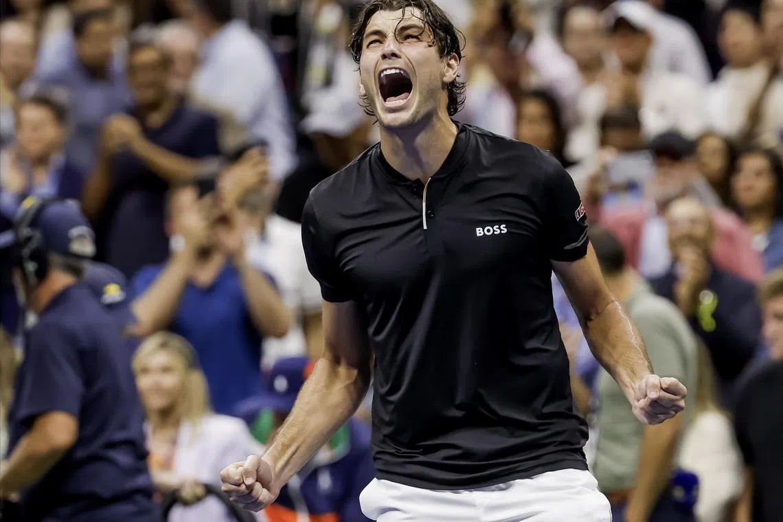 Taylor Fritz celebrates after beating his fellow American Frances Tiafoe in the semi-finals of the US Open. He will next face world No. 1 Jannik Sinner in the final.