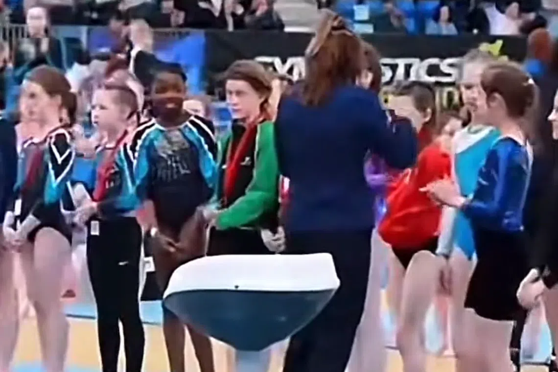 The official snubbed the girl, instead moving down the line to give other gymnasts their medals.