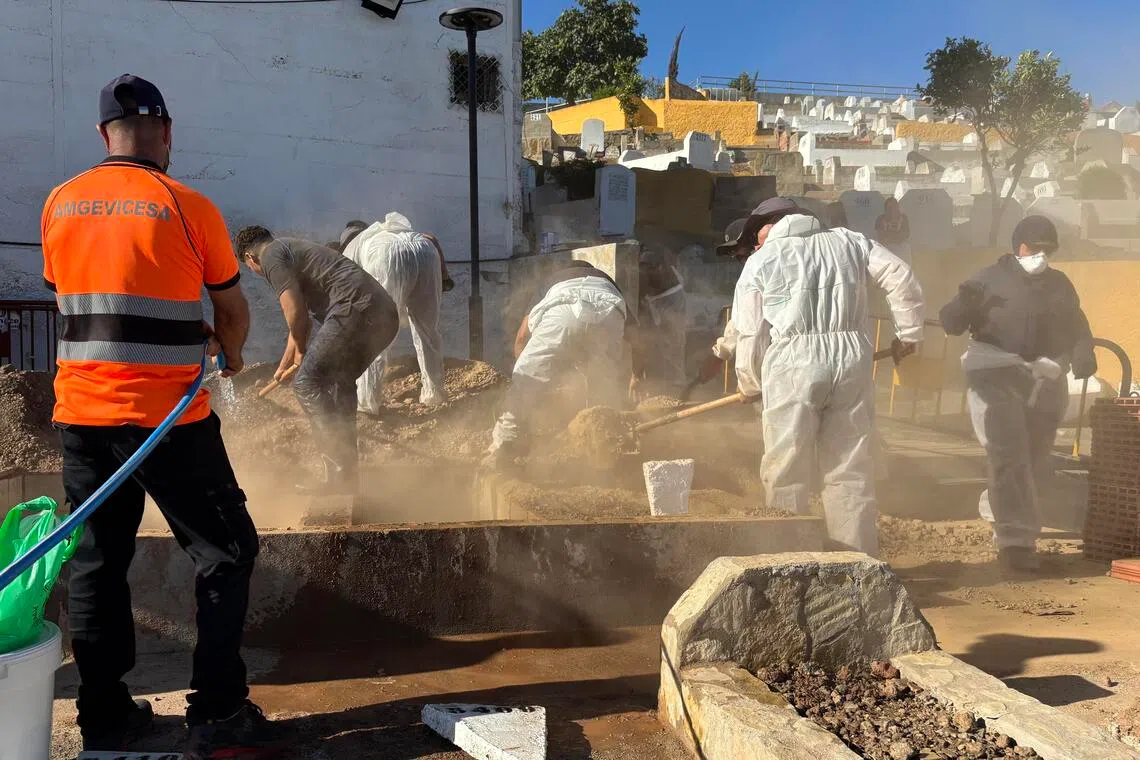 Workers digging graves on Aug 21 for the burial of migrants who died while trying to cross to the Spanish enclave Ceuta from Morocco on July 30.