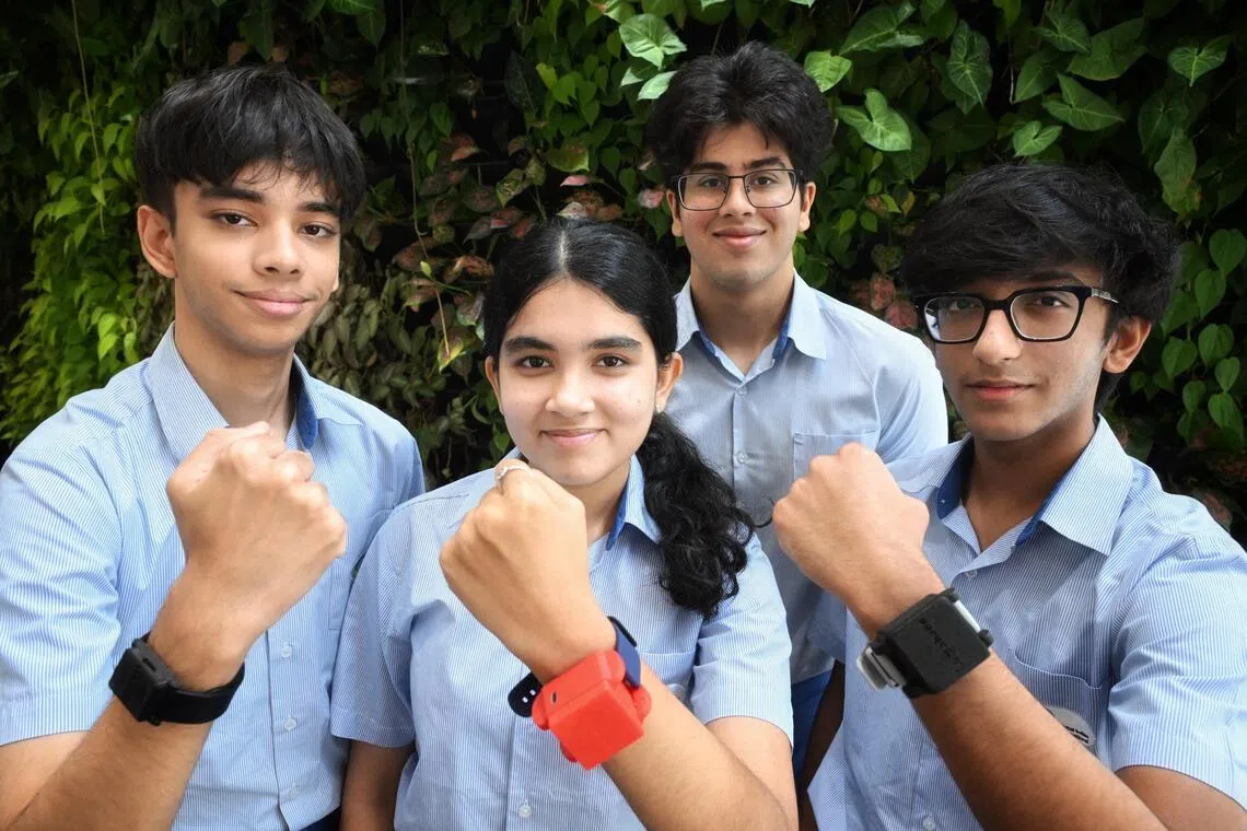(From left) Iraj Gupta, Srishti Hariharan, Anuraag Vombatkere and Arnav Rai showing their lumabands at the One World International School on Sept 18.