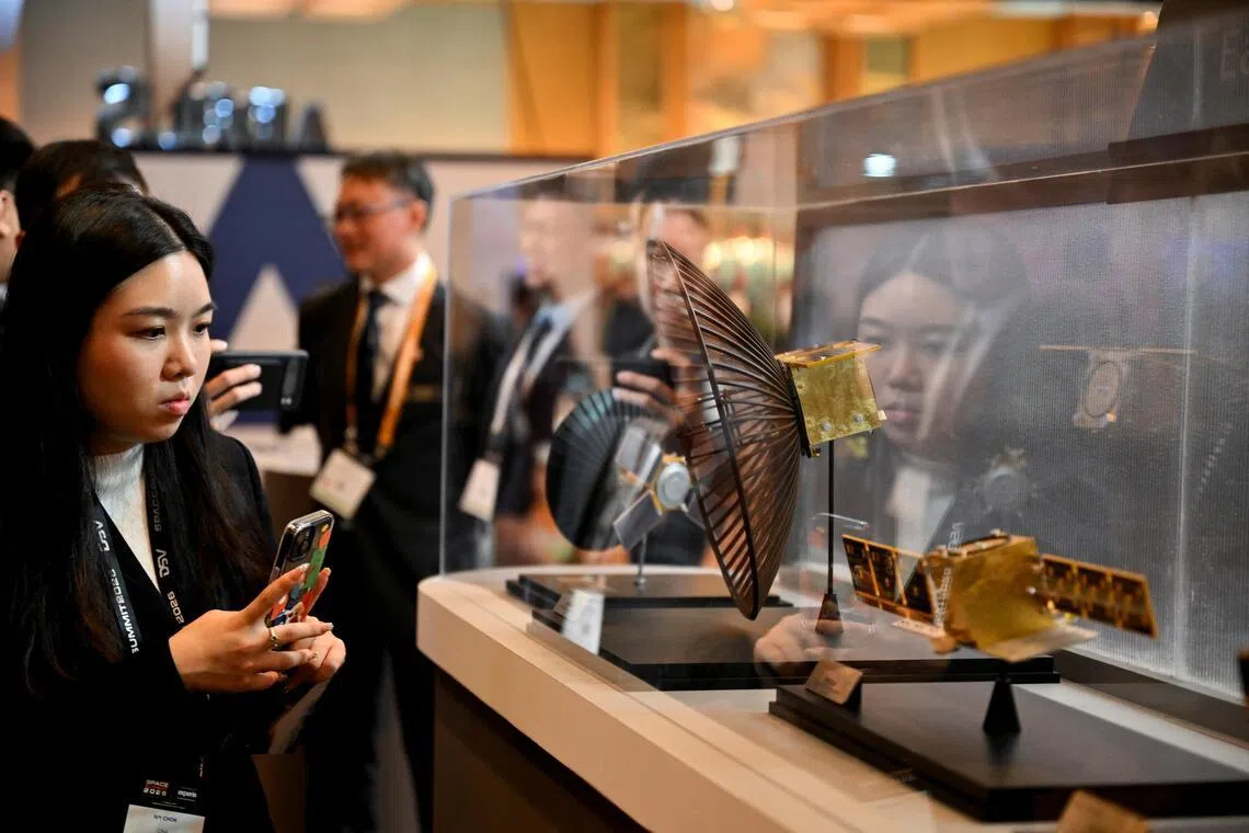 Satellite models on display at the ST Engineering booth at the Space Summit at Sands Expo and Convention Centre on Feb 2. 