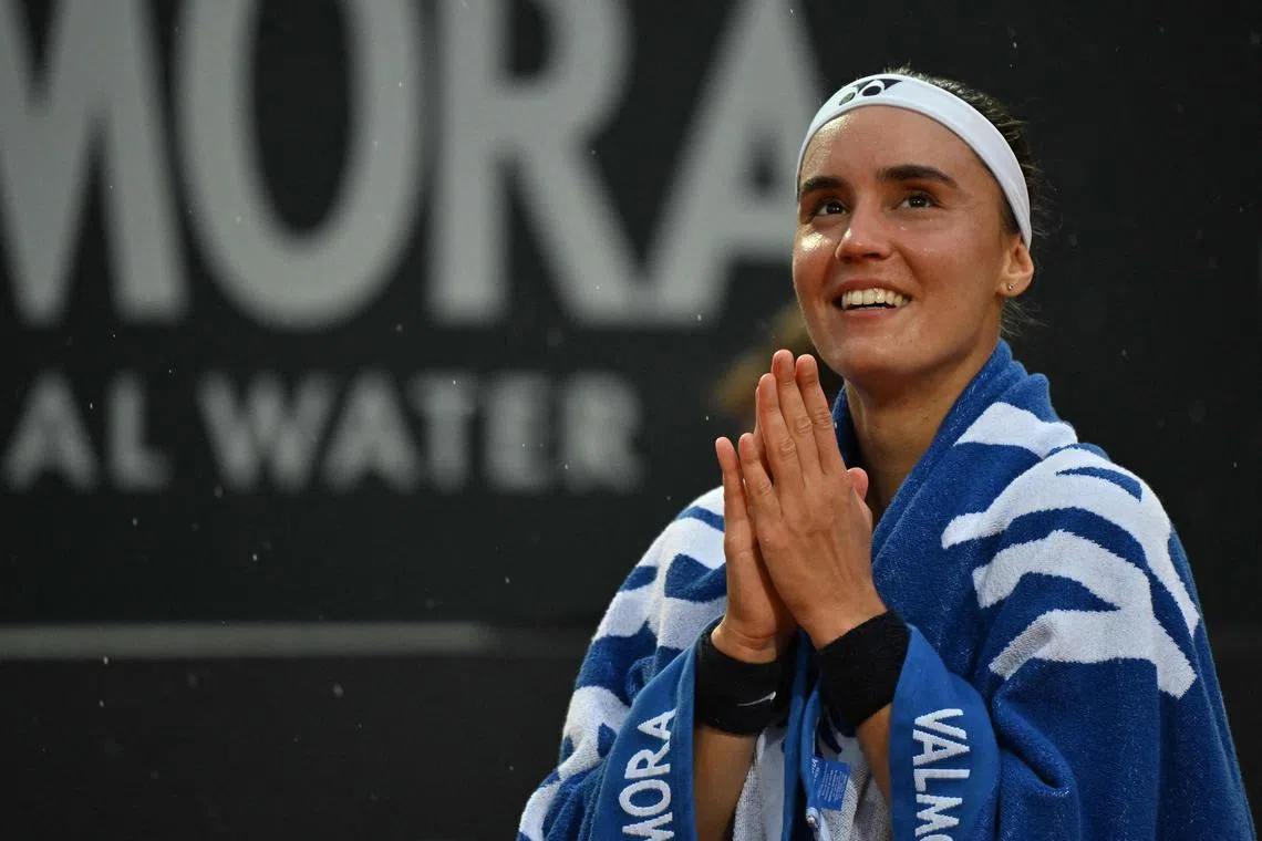 Ukraine's Anhelina Kalinina celebrates after defeating Russia's Veronika Kudermetova in their semifinals match.