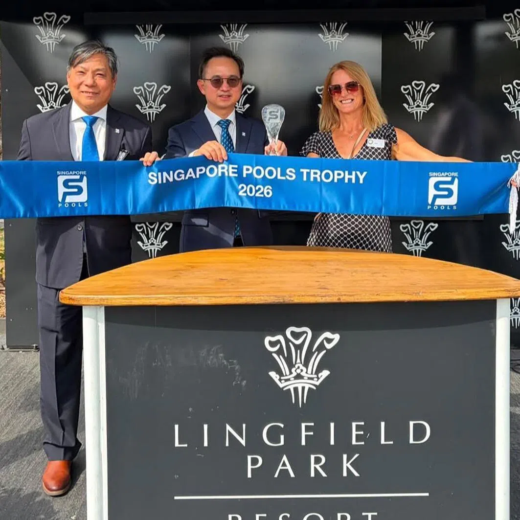 pools19 - Singapore Pools’ chief product officer Simon Leong (near right), chief executive officer Lam Chee Weng (centre) and owner representative Jayne Howick are all smiles after Rapide Vega won the inaugural Singapore Pools Trophy (1,600m) at Lingfield on Aug 17. 
PHOTO COURTESY OF SINGAPORE POOLS