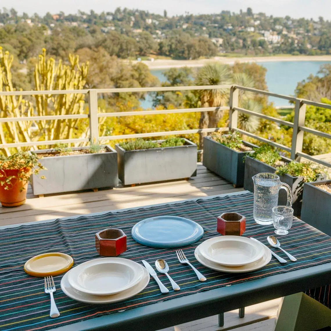 Kerrilynn Pamer’s outdoor dining setup at her home in Los Angeles, March 3, 2026. Interior design and personal style are being showcased more often on dining room tables around the country. (Stella Kalinina/The New York Times)