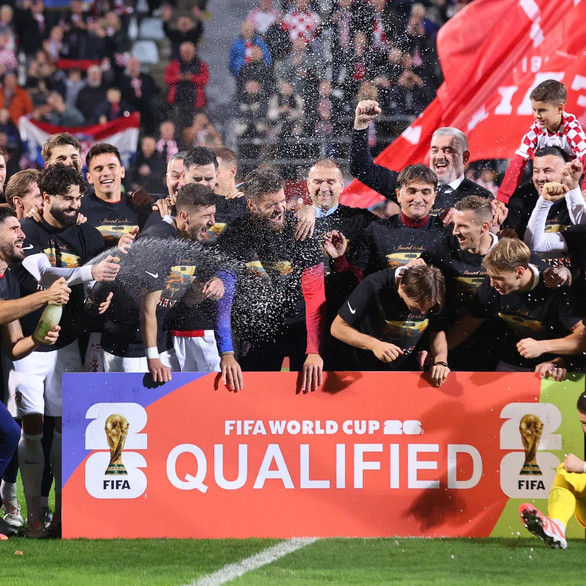Soccer Football - World Cup - UEFA Qualifiers - Group L - Croatia v Faroe Islands - Stadion HNK Rijeka, Rijeka, Croatia - November 14, 2025 Croatia playeres celebrate after qualifying for the World Cup finals REUTERS/Antonio Bronic