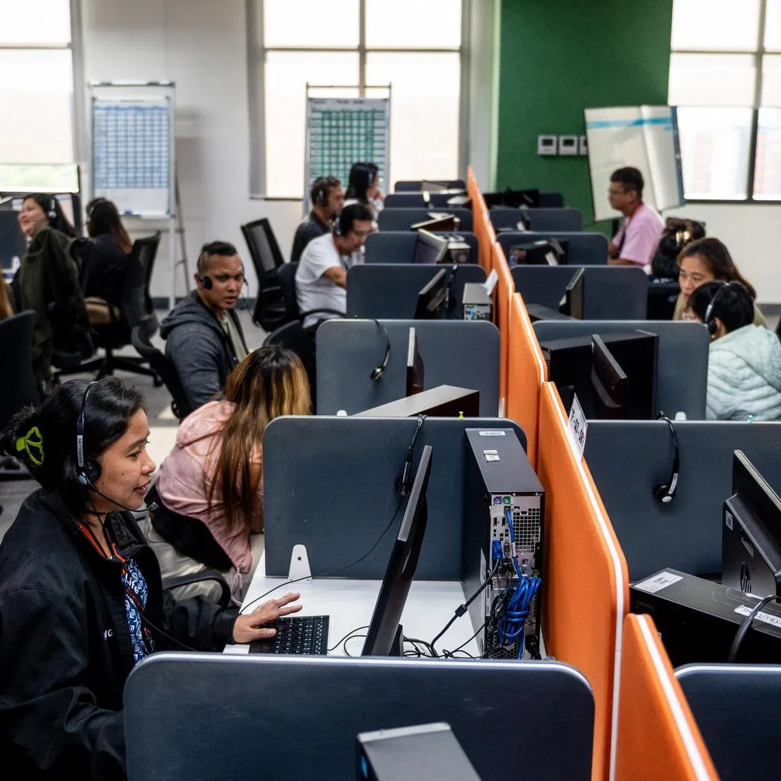 Customer agents at a call centre in Metro Manila on April 24, 2024. There are fears the US could make it harder or less attractive for American firms to outsource customer service work overseas.