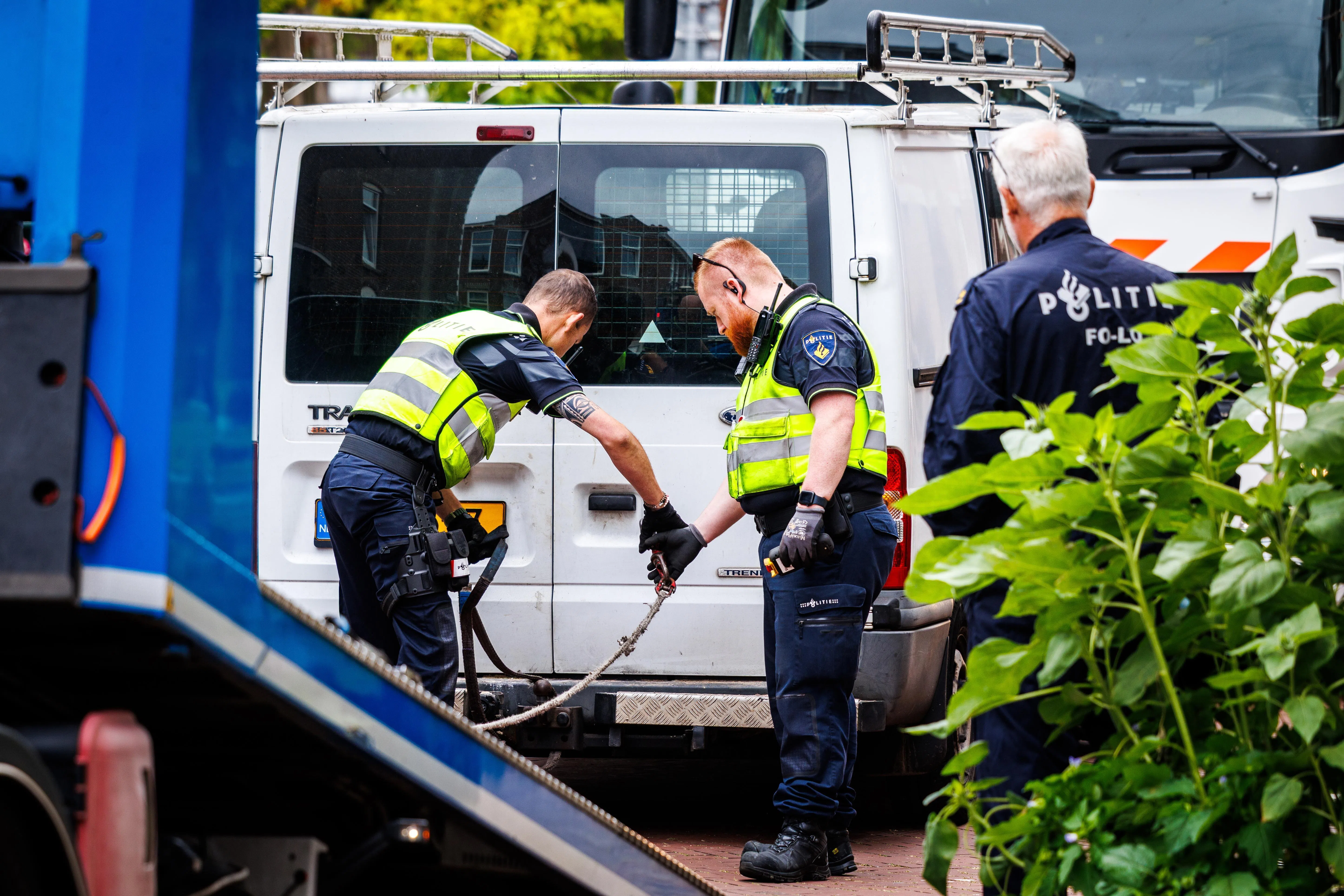 epa13118740 Police remove a van from a house where a drug lab was discovered on Meidoornstraat in The Hague, Netherlands, 18 July 2026. Very large quantities of substances were found at the property.  EPA/JOHN VAN DER TOL