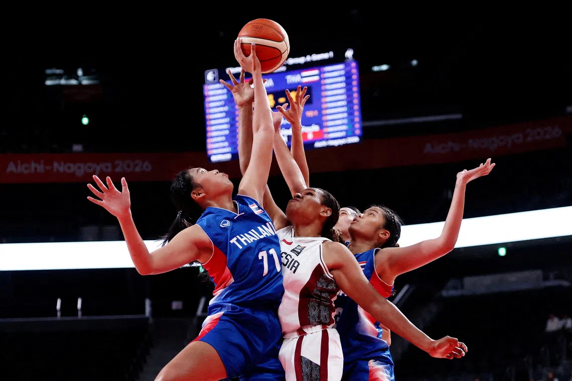 Asian Games - Aichi-Nagoya 2026 - Basketball - Women's - Group A - Indonesia v Thailand - Aichi International Arena, Nagoya, Japan - September 17, 2026 Thailand's Chosita Sakaret in action with Indonesia's Lea Kahol REUTERS/Edgar Su TPX IMAGES OF THE DAY