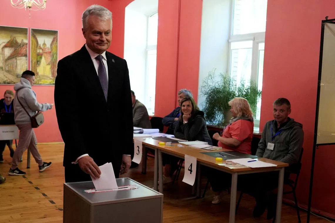 FILE PHOTO: Lithuanian President Gitanas Nauseda casts his vote during a presidential election in Vilnius, Lithuania May 12, 2024. REUTERS/Ints Kalnins/File Photo