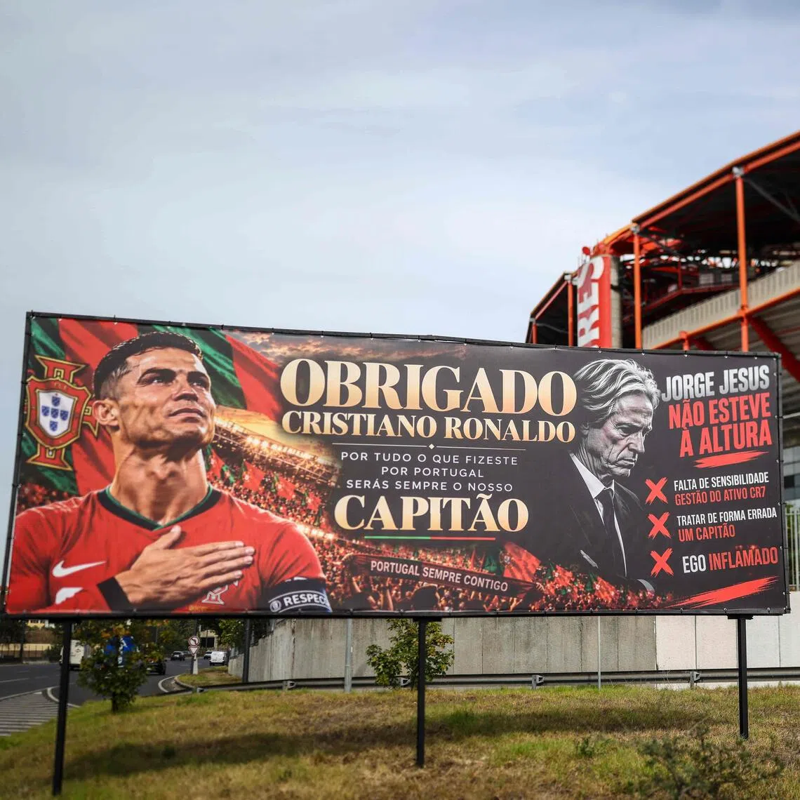 A billboard in support of Portugal forward Cristiano Ronaldo mixed with an adjacent message critical against Portugal coach Jorge Jesus in Lisbon.