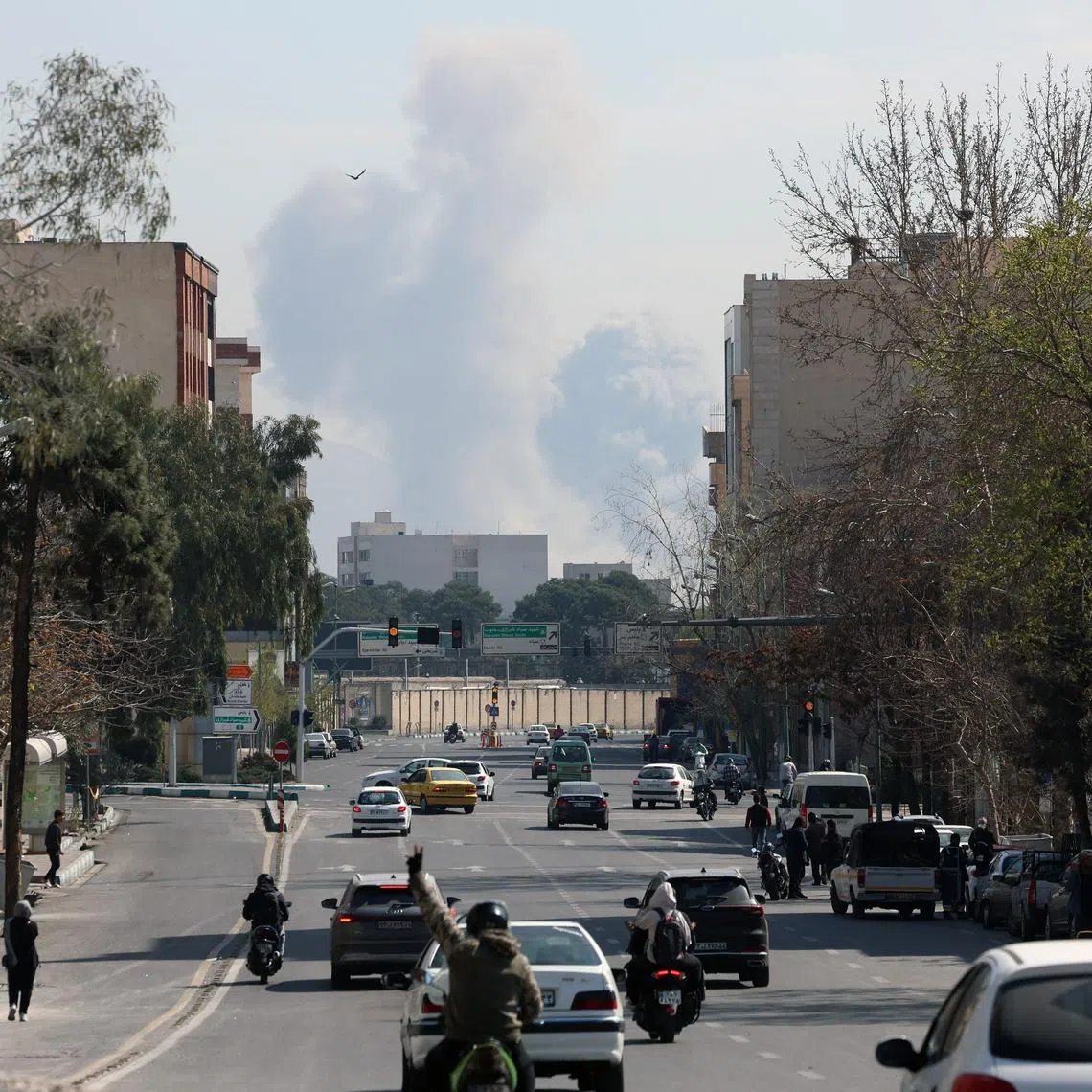 Smoke rising in central Tehran on March 4 after an air strike on a street.