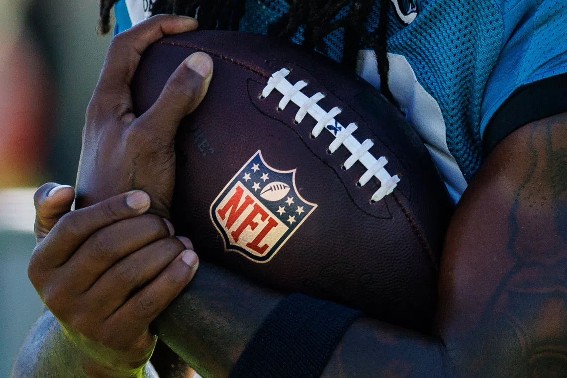 Aug 13, 2026; Metairie, LA, USA;  Detailed view of the NFL logo on the football during a joint scrimmage between the New Orleans Saints and the Jacksonville Jaguars during at Ochsner Sports Performance Center. Mandatory Credit: Stephen Lew-Imagn Images/File Photo