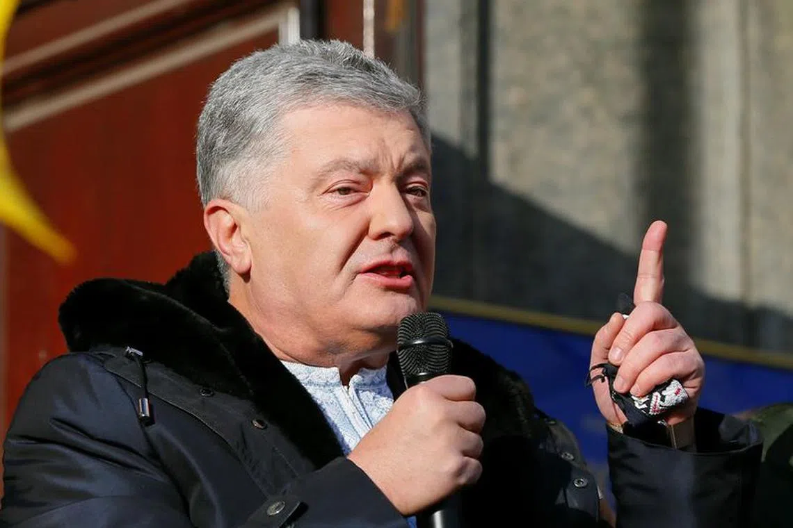File photo: Ukrainian former President Petro Poroshenko, who is suspected of high treason by financing pro-Russian separatists in eastern Ukraine while in office in 2014-2015, addresses his supporters outside a court building before a hearing in Kyiv, Ukraine January 19, 2022. REUTERS/Gleb Garanich/File photo